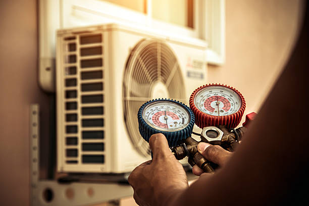 Professional Air Conditioning Service technician working in Los Alamos, NM
